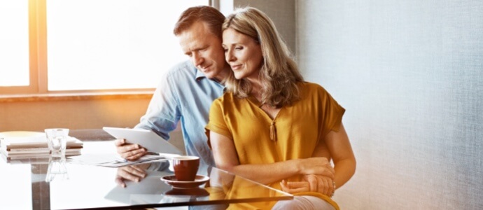 Husband and wife reviewing documents