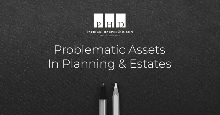 "Problematic Assets in Planning & Estates" written on a board