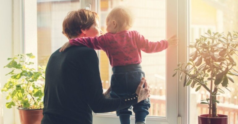 Grandmother playing with her toddler granddaughter