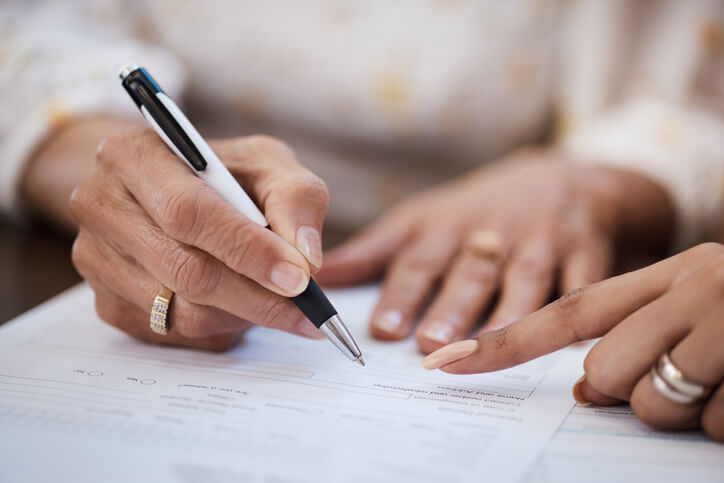 Woman signing estate plan