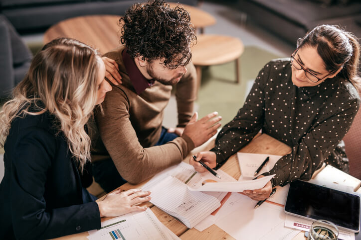 Business associates sitting with a business attorney