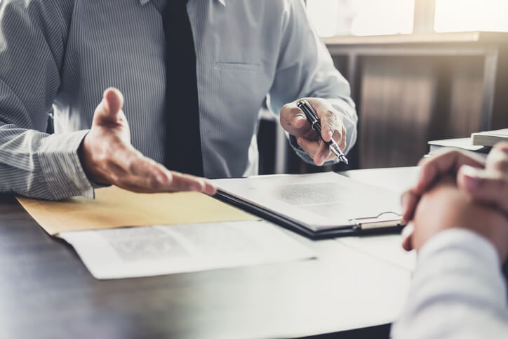 business attorney sitting with client