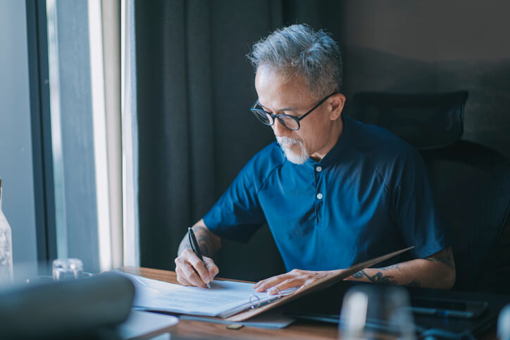 Older man working on his estate plan