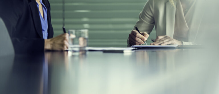 Business attorney sitting with a client