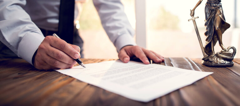 Businessman Signing An Official Document