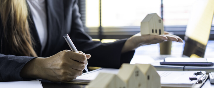 A real estate lawyer signing